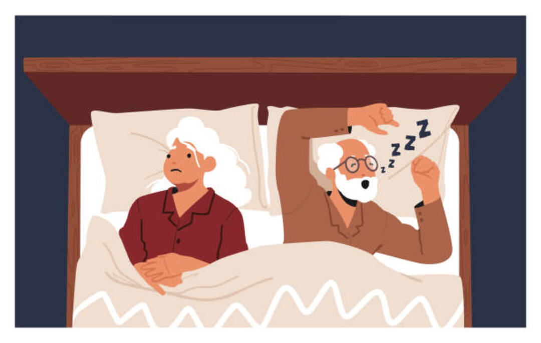 An elderly couple in bed, with one partner snoring loudly.